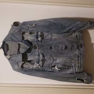 Womans Jean jacket. Distressed, ripped jean jacket. Tiger print on back.